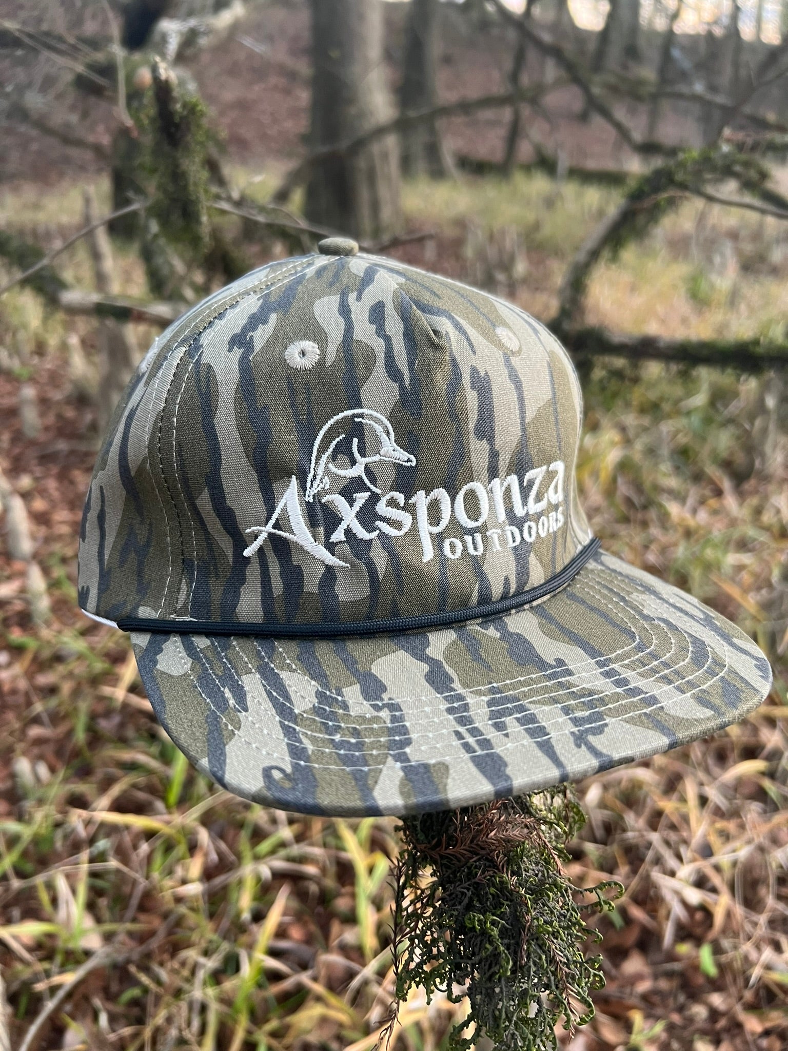 Woodie Head Oulined Embroidered Rope Hat in Mossy Oak Bottomland